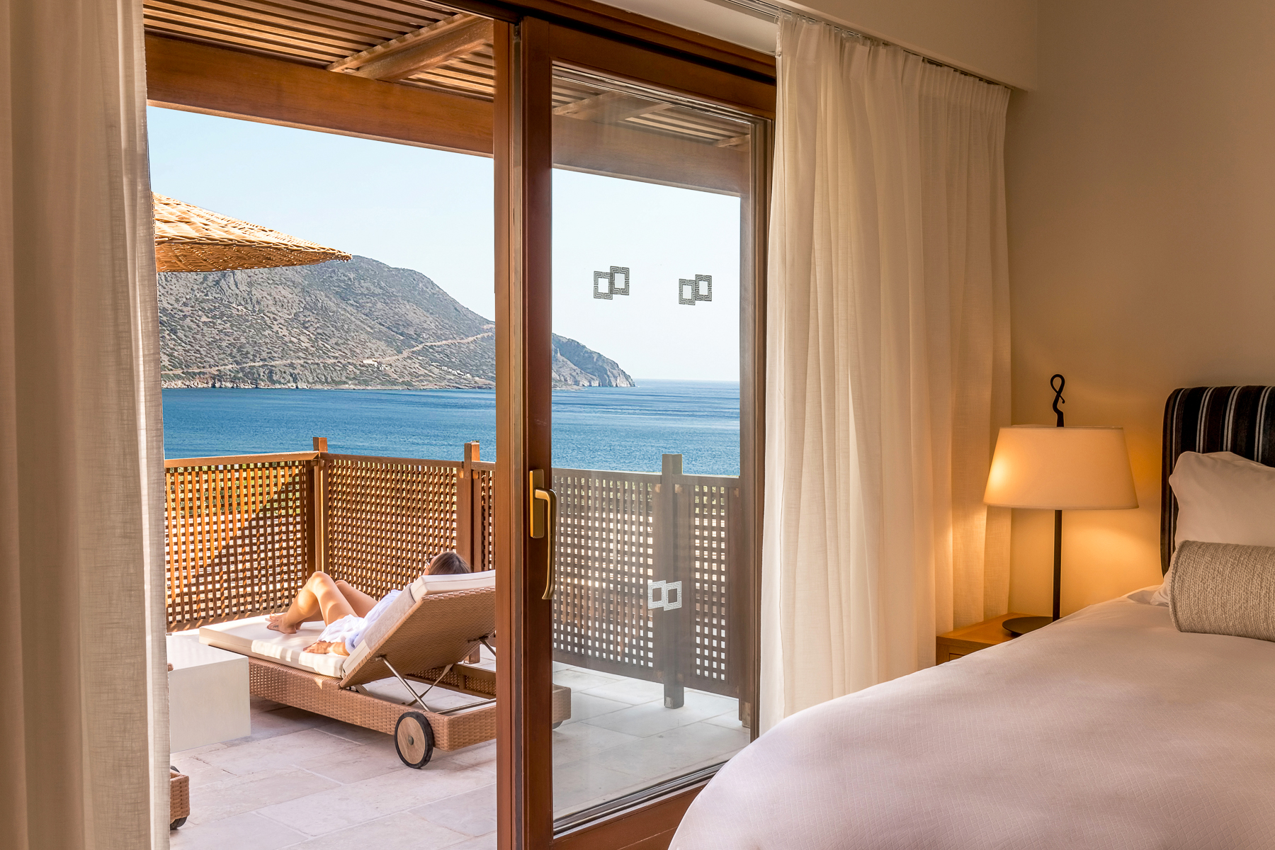 Private terrace and guest suite at Phāea Blue Palace in Crete