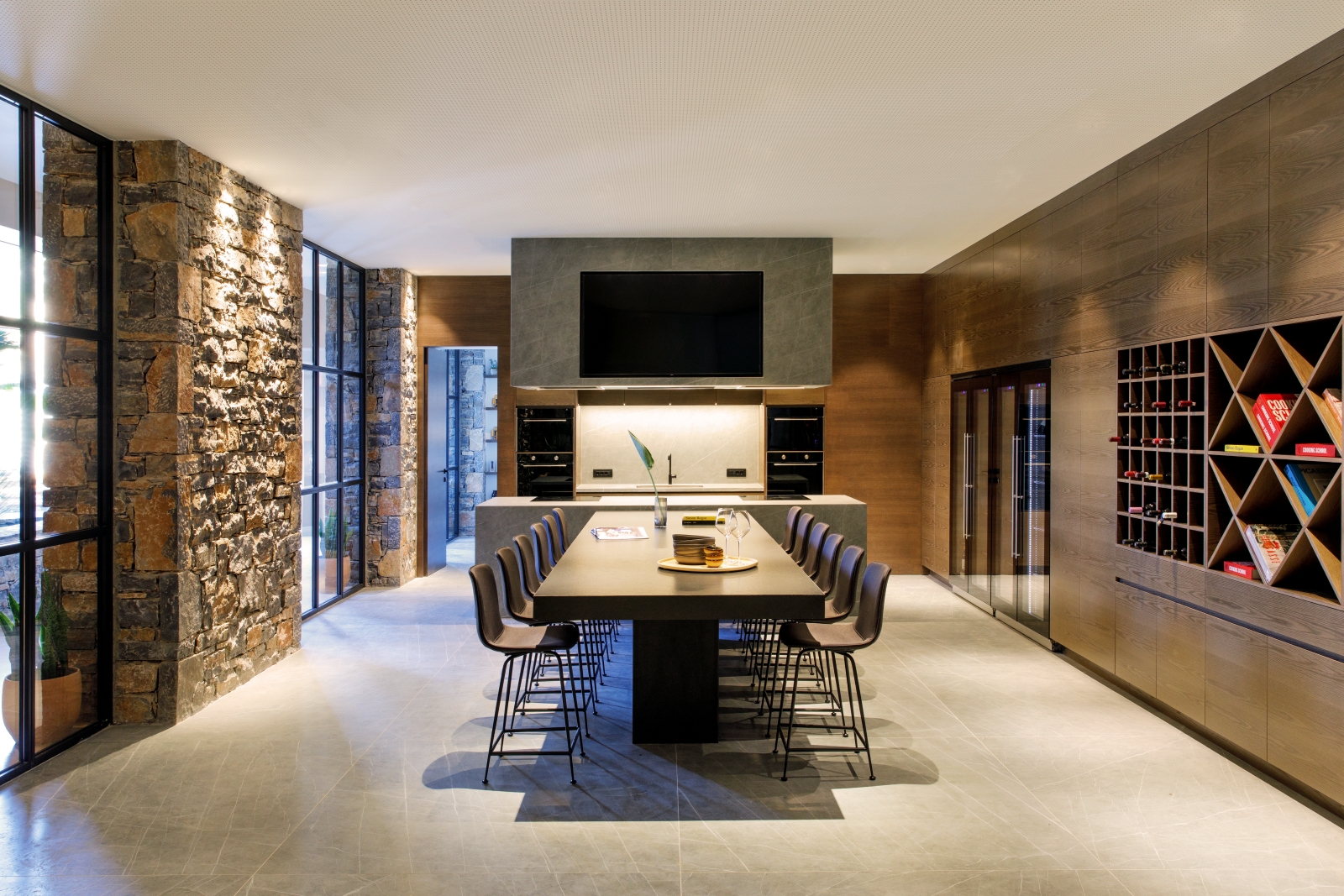 Dining table and show kitchen in the private Culinary School at luxury resort Daios Cove in Greece