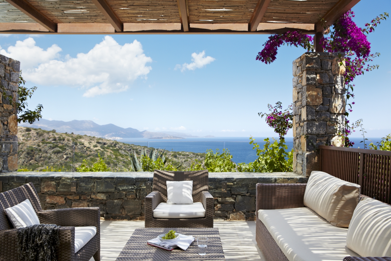 Sea view from the private terrace of a Deluxe Room at luxury resort Daios Cove in Greece