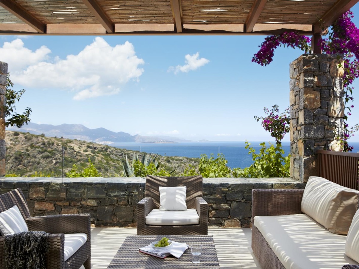 Sea view from the private terrace of a Deluxe Room at luxury resort Daios Cove in Greece