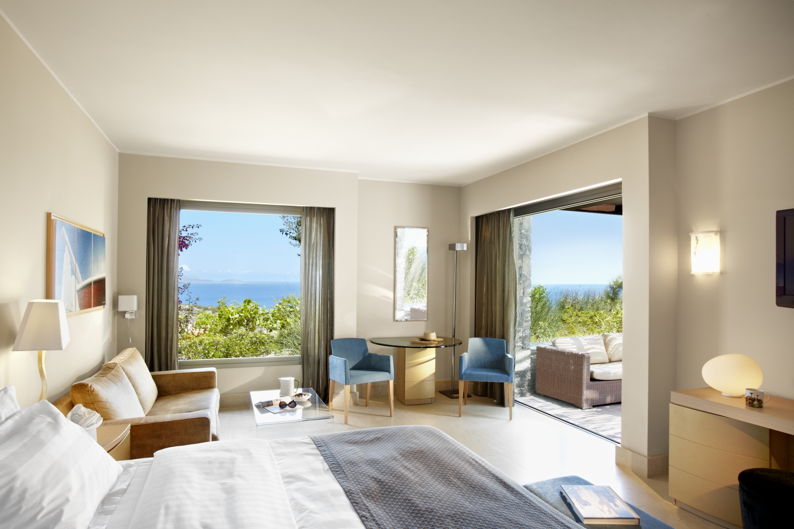 Interior of a Junior Suite with private terrace at luxury resort Daios Cove in Greece