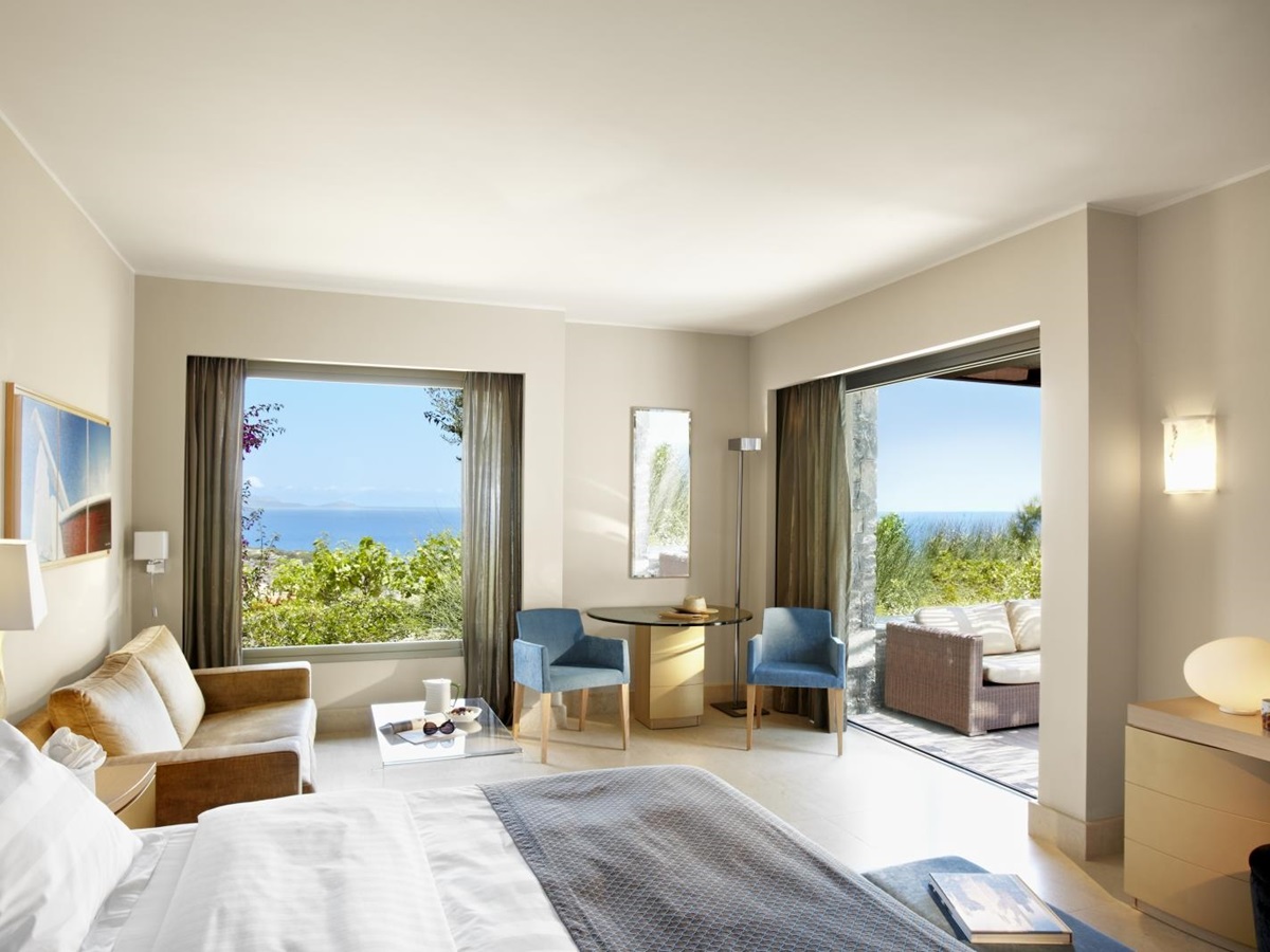 Interior of a Junior Suite with private terrace at luxury resort Daios Cove in Greece