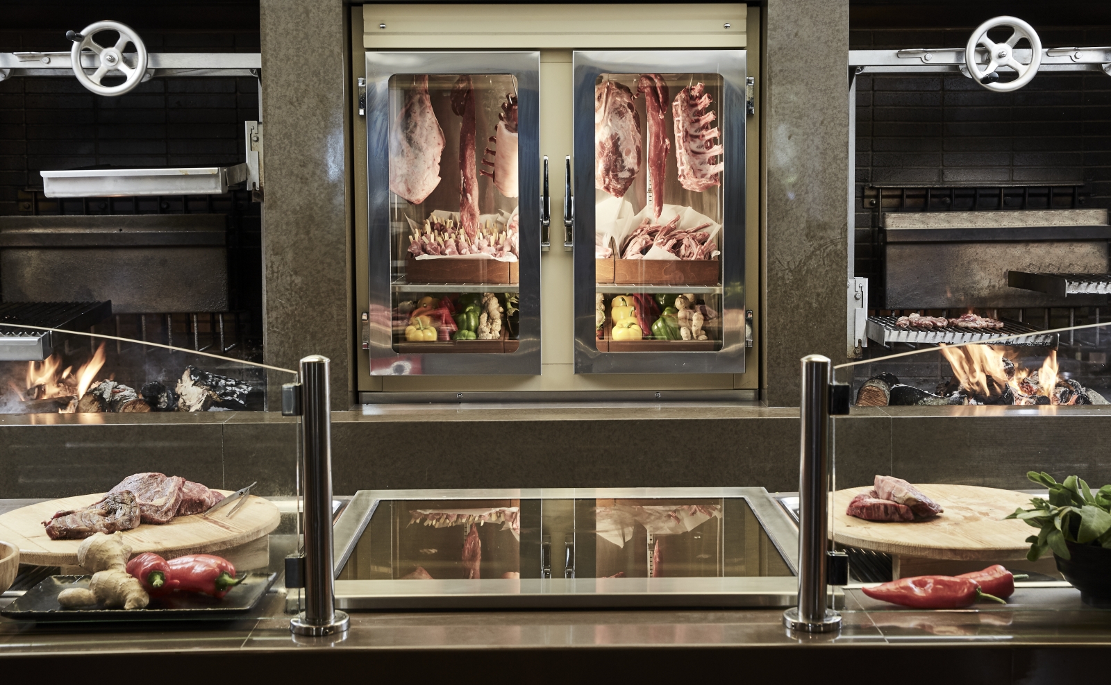 Grill counter with fresh meat at Pangea Restaurant at luxury resort Daios Cove in Greece