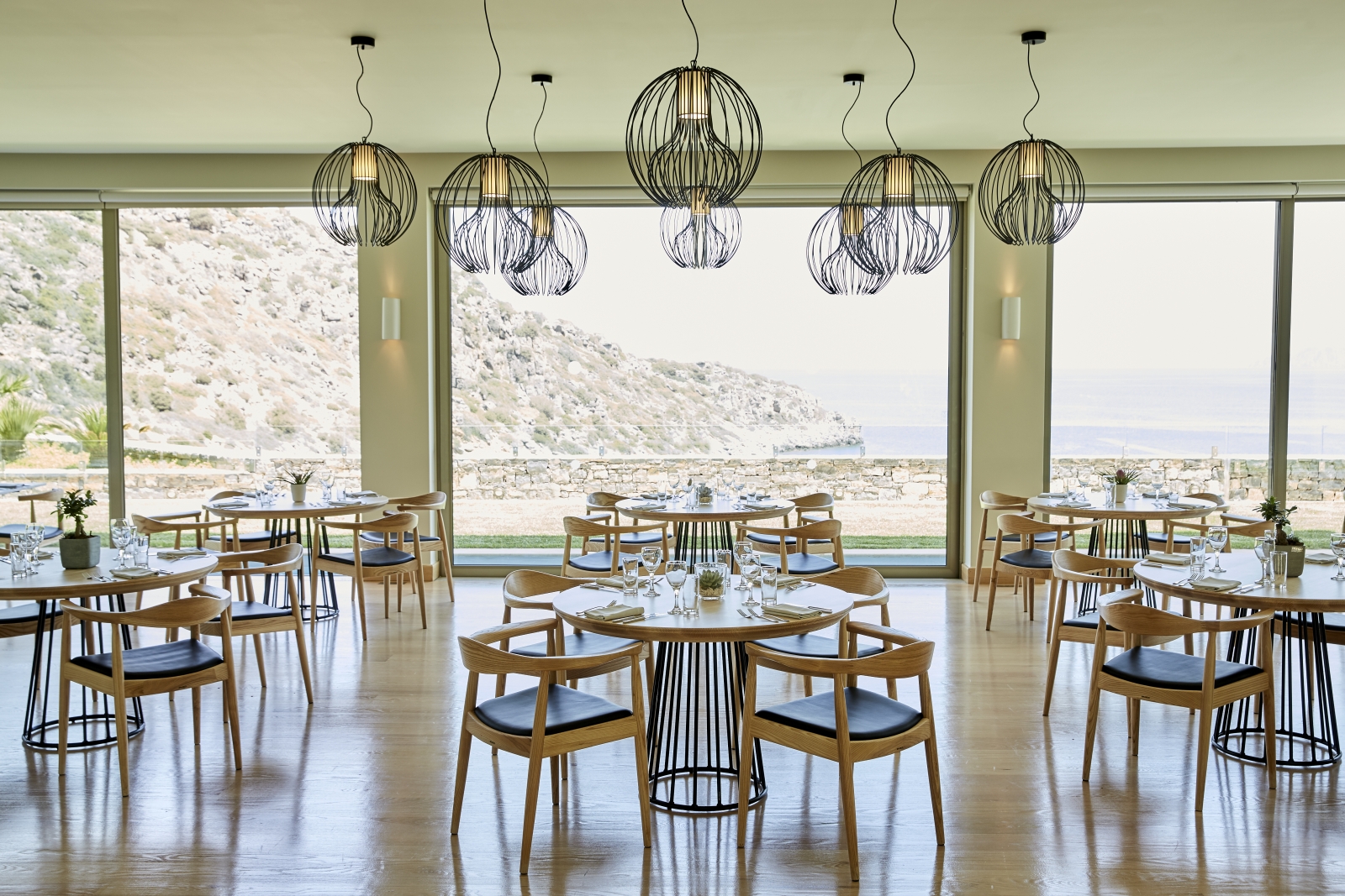 Spacious dining area at Pangea Restaurant at luxury resort Daios Cove in Greece