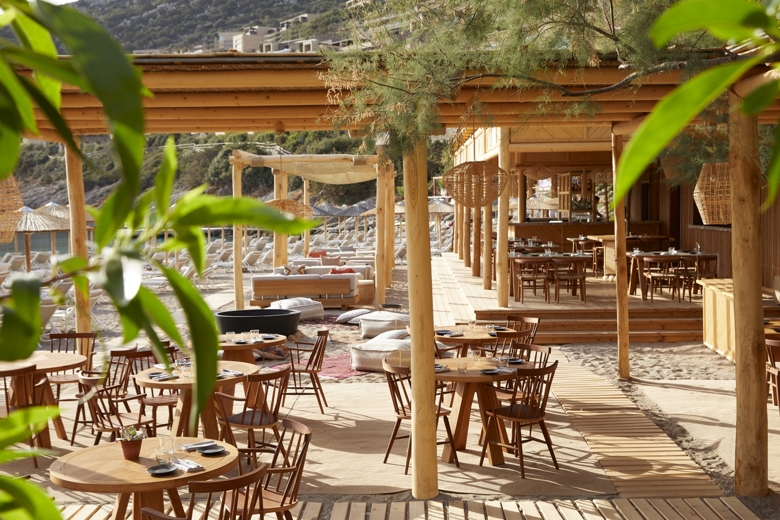 Relaxed beach front restaurant and bar The Beach House at luxury resort Daios Cove in Greece