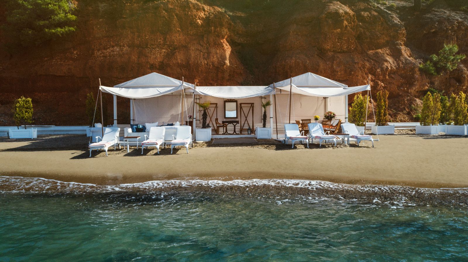 Sun loungers on the beach at luxury resort Danai Beach in Greece