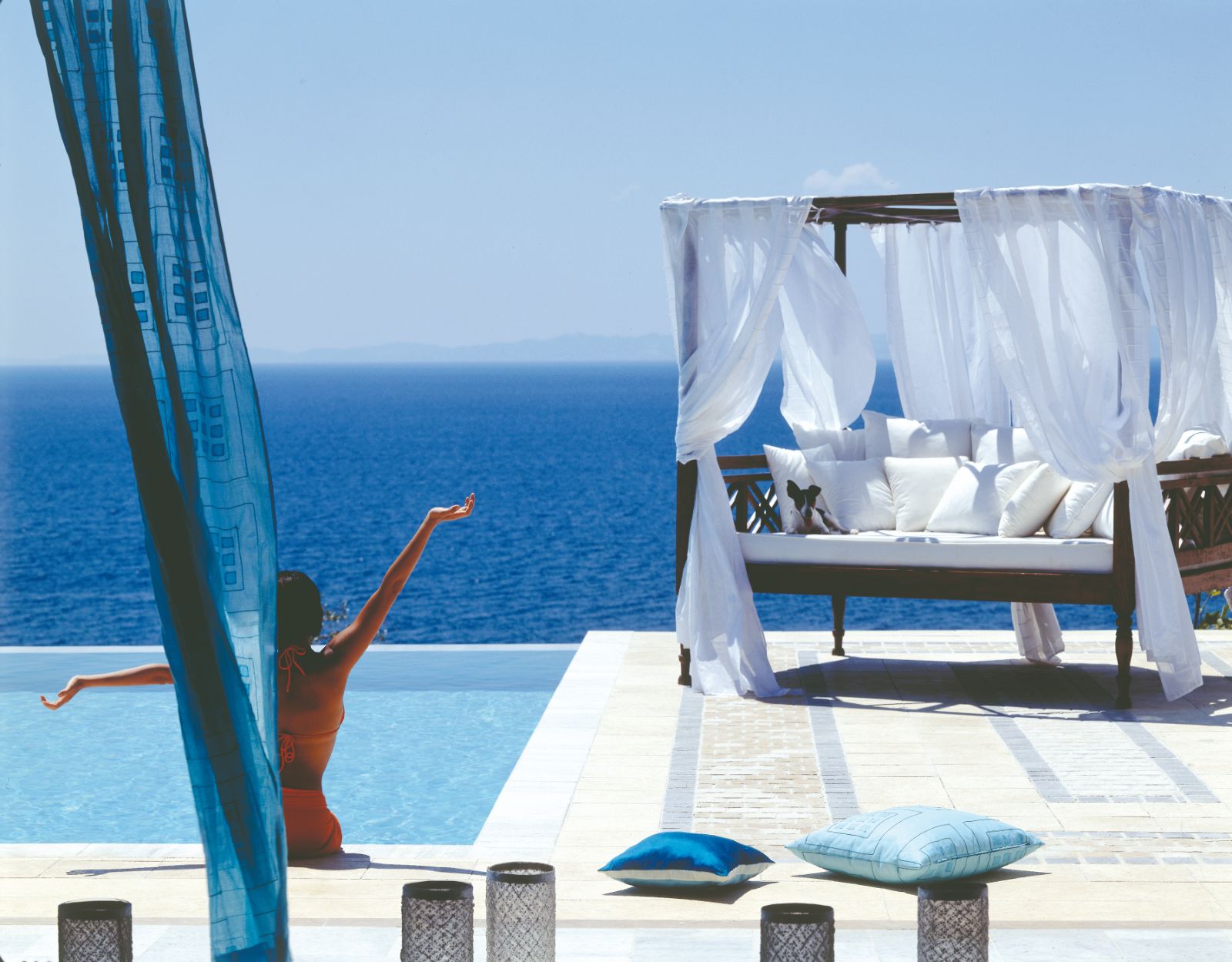 Guest enjoying the pool and sea at luxury resort Danai Beach in Greece