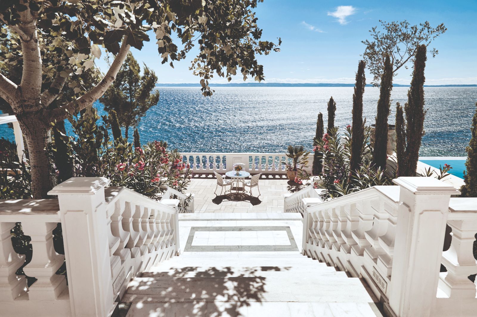 Stairs leading to the seaside terrace at luxury resort Danai Beach in Greece