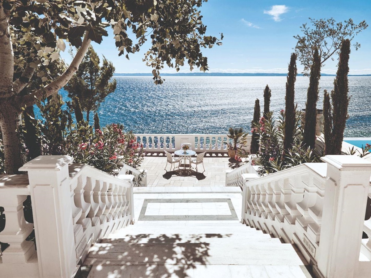Stairs leading to the seaside terrace at luxury resort Danai Beach in Greece