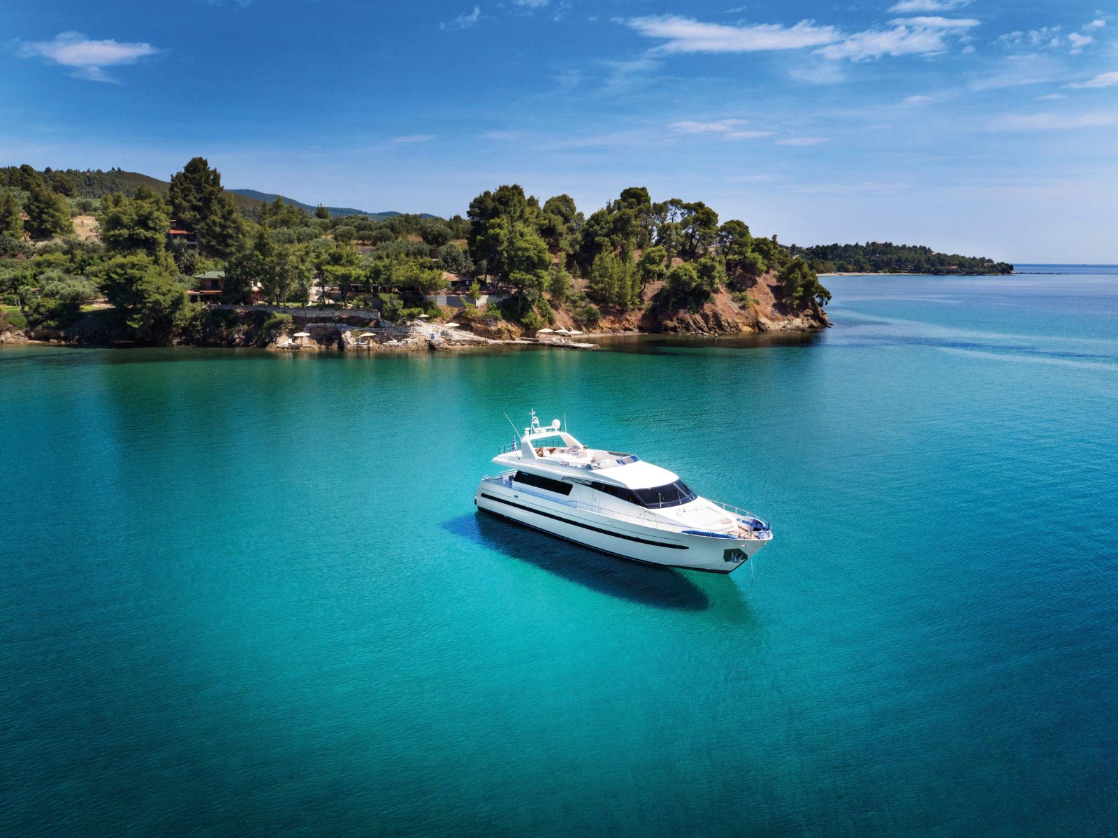 Aerial photo of Danai Beach's yacht in the turquoise Mediterranean Sea