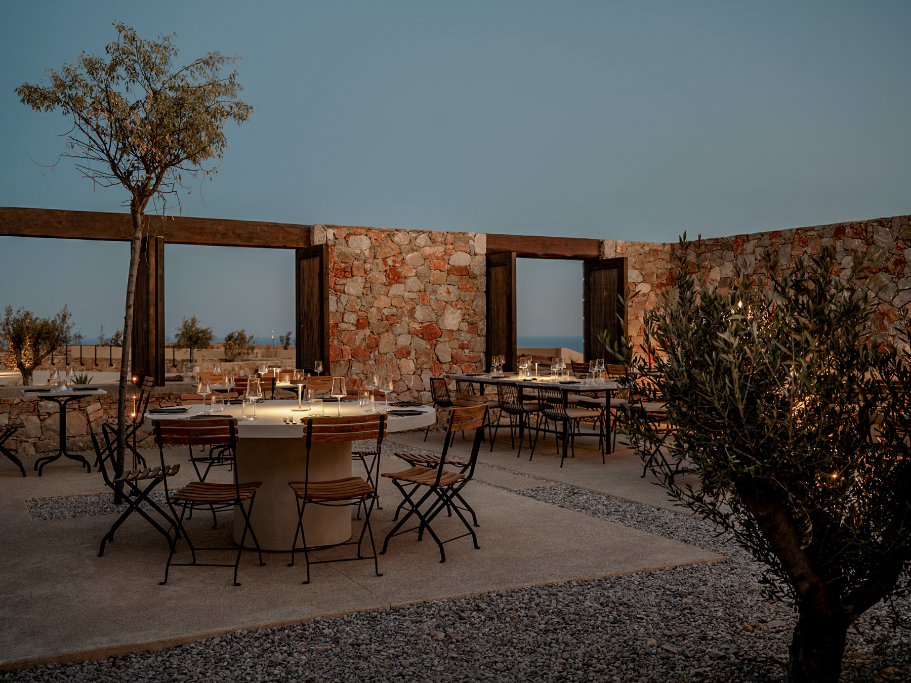 Alfresco dining tables at Gundari luxury resort restaurant in Greece