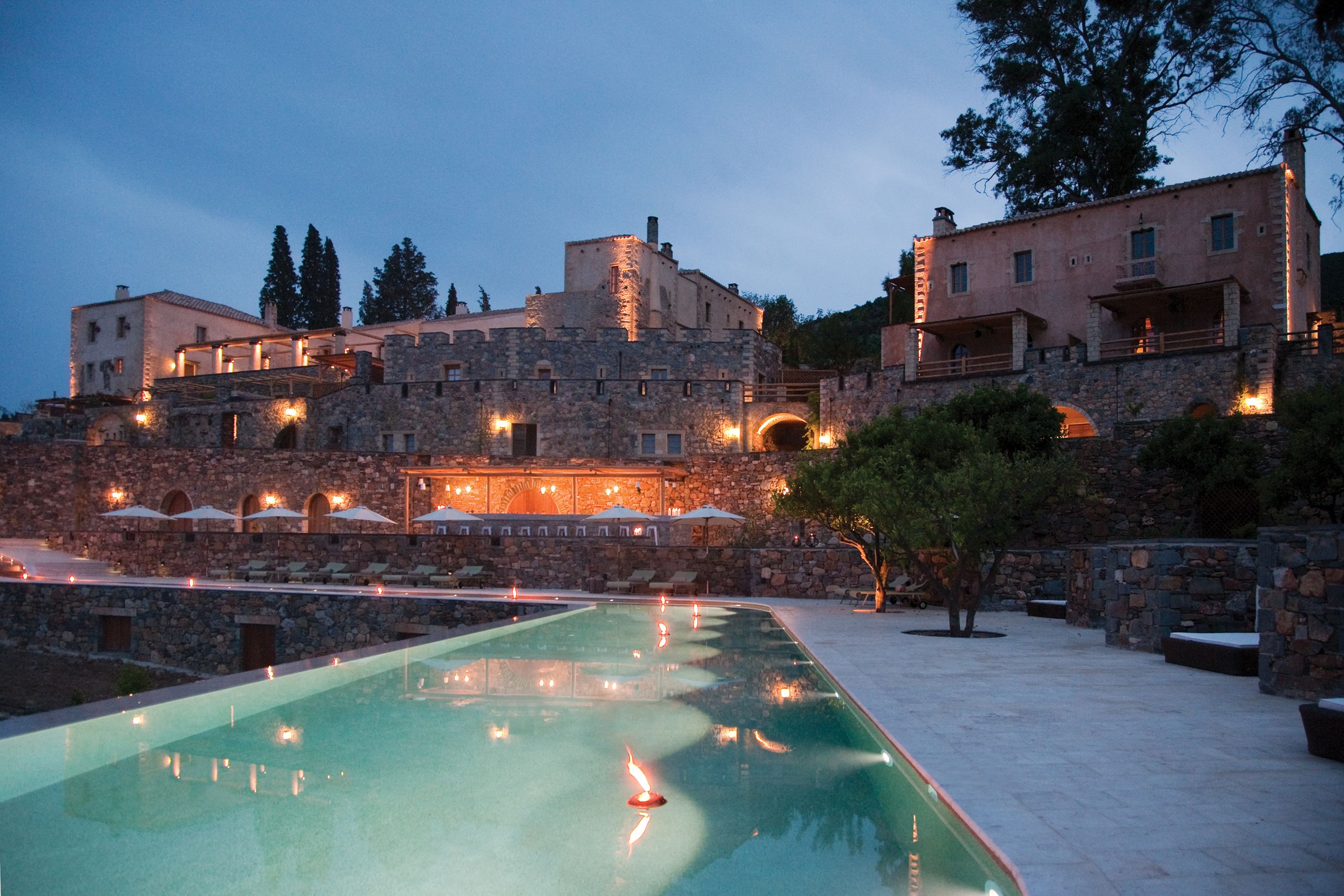 Swimming pool with facade at night of Kinsterna Hotel Monemvasia, Greece