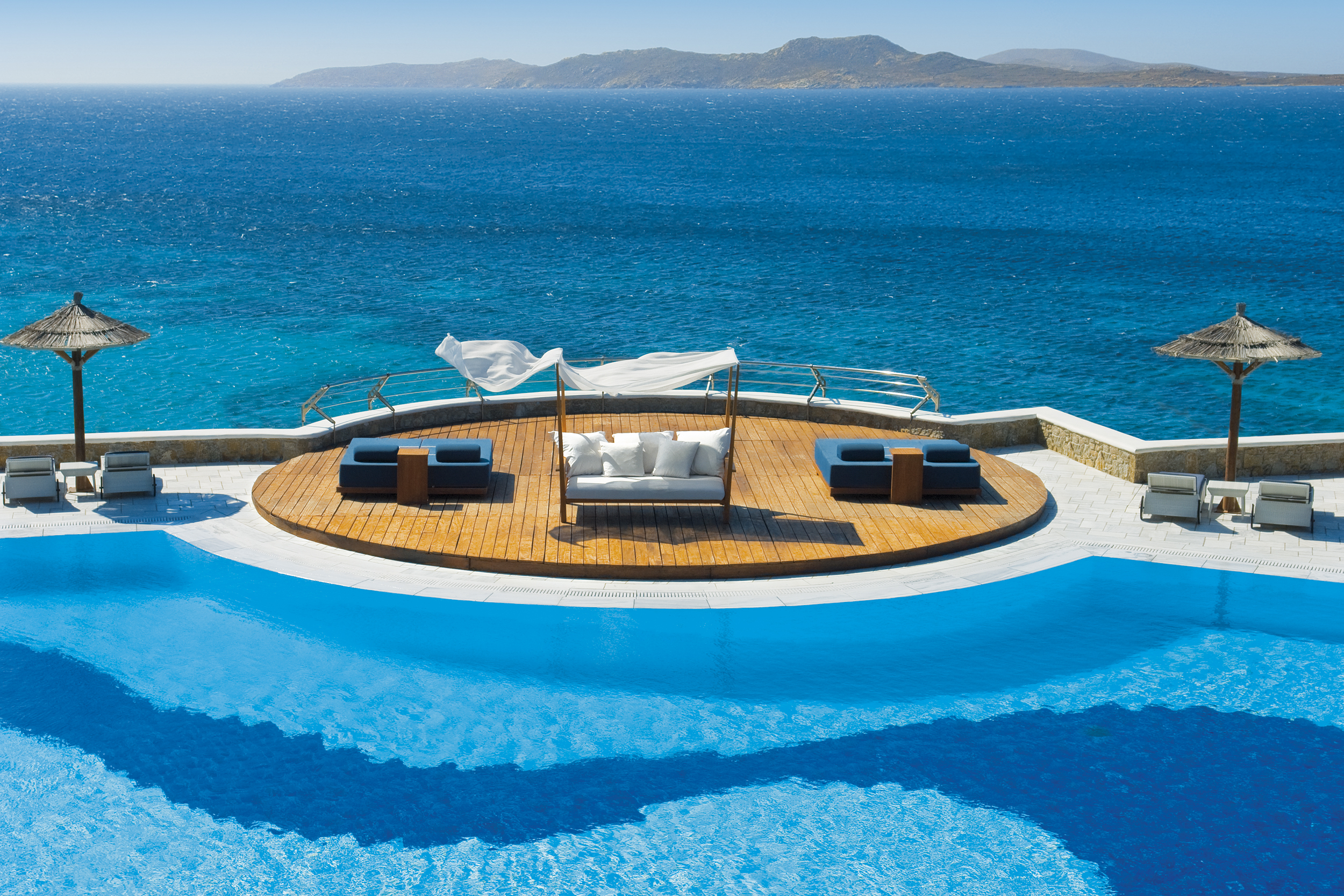 The swimming pool with sundowners of Mykonos Grand Hotel, Greece
