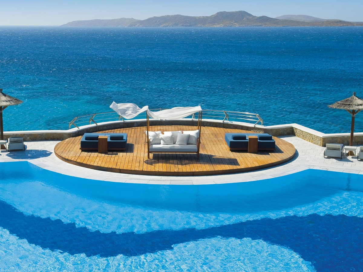 The swimming pool with sundowners of Mykonos Grand Hotel, Greece