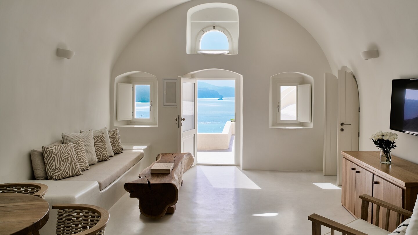 Cavernous room with view at Mystique in Santorini Greece