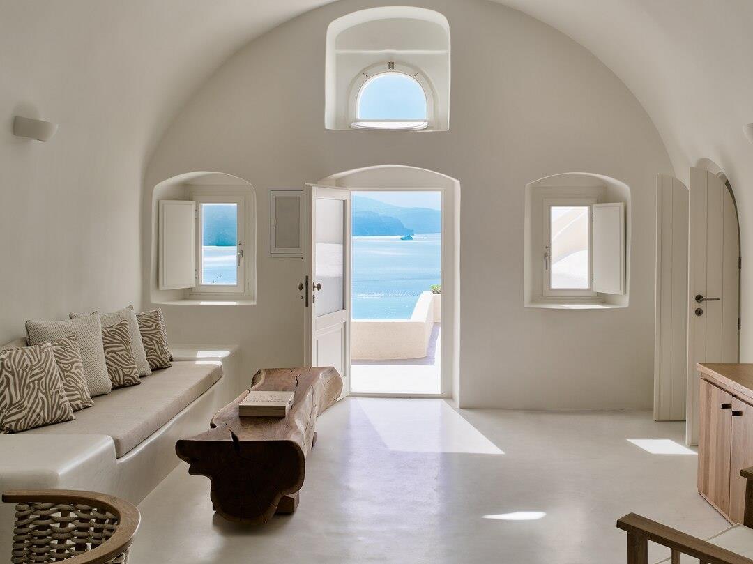 Cavernous room with view at Mystique in Santorini Greece