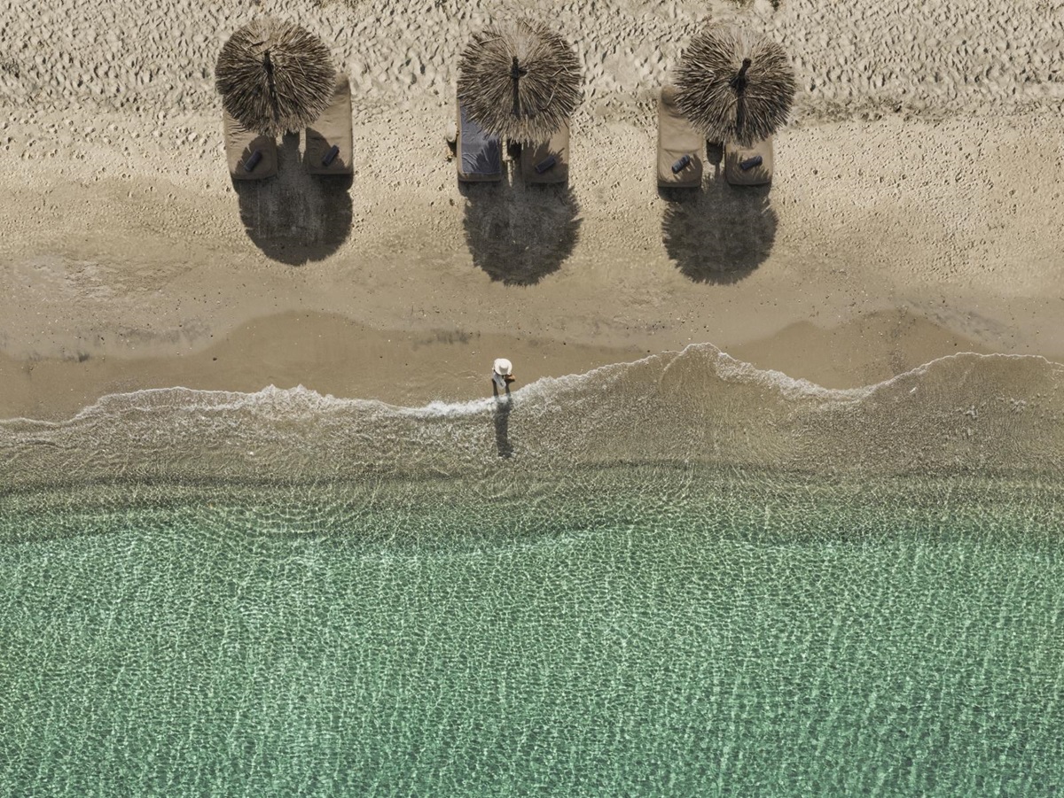 Aerial view of parasols on the beach at luxury hotel OKU Kos in Greece