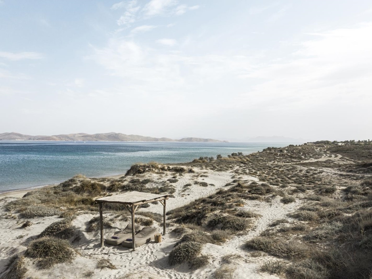 View over a beach cabana and empty beach at luxury hotel OKU Kos in Greece