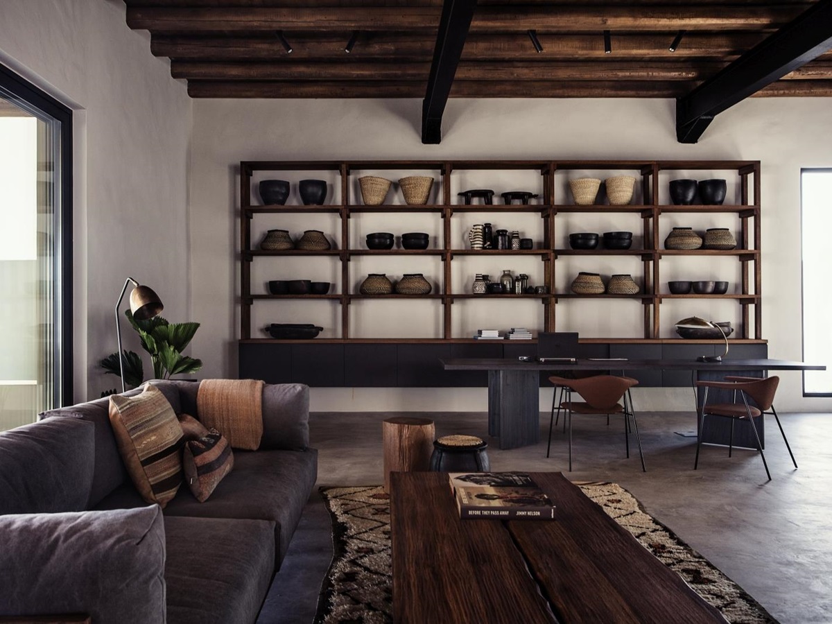 Lounge with working space, seating area and rustic decor at luxury hotel OKU Kos in Greece