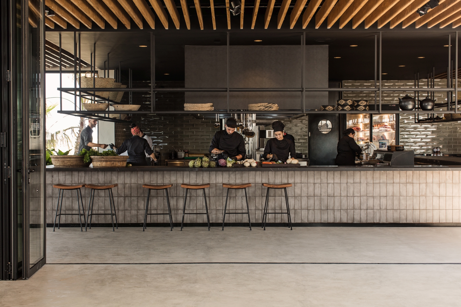 Chefs at work preparing the delicious fresh food at luxury hotel OKU Kos in Greece