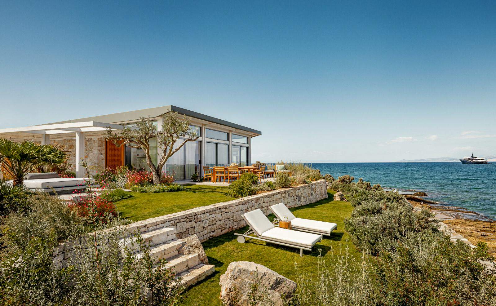 Villa garden and terrace overlooking the ocean at One&Only Aesthesis in Athens