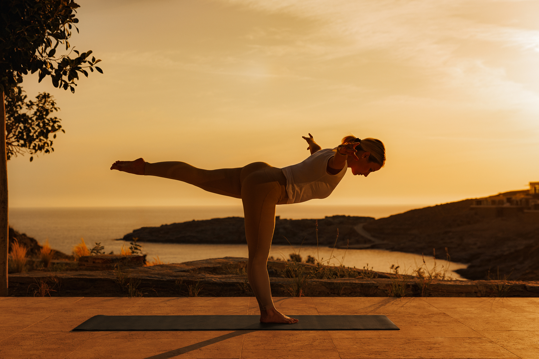 A woman doing yoga at One&Only Kea Island in Greece