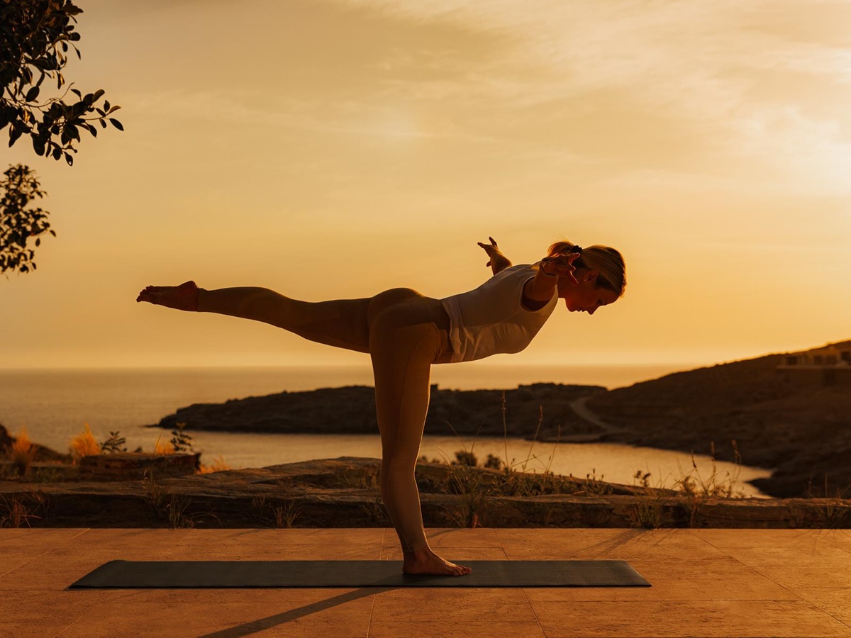 A woman doing yoga at One&Only Kea Island in Greece