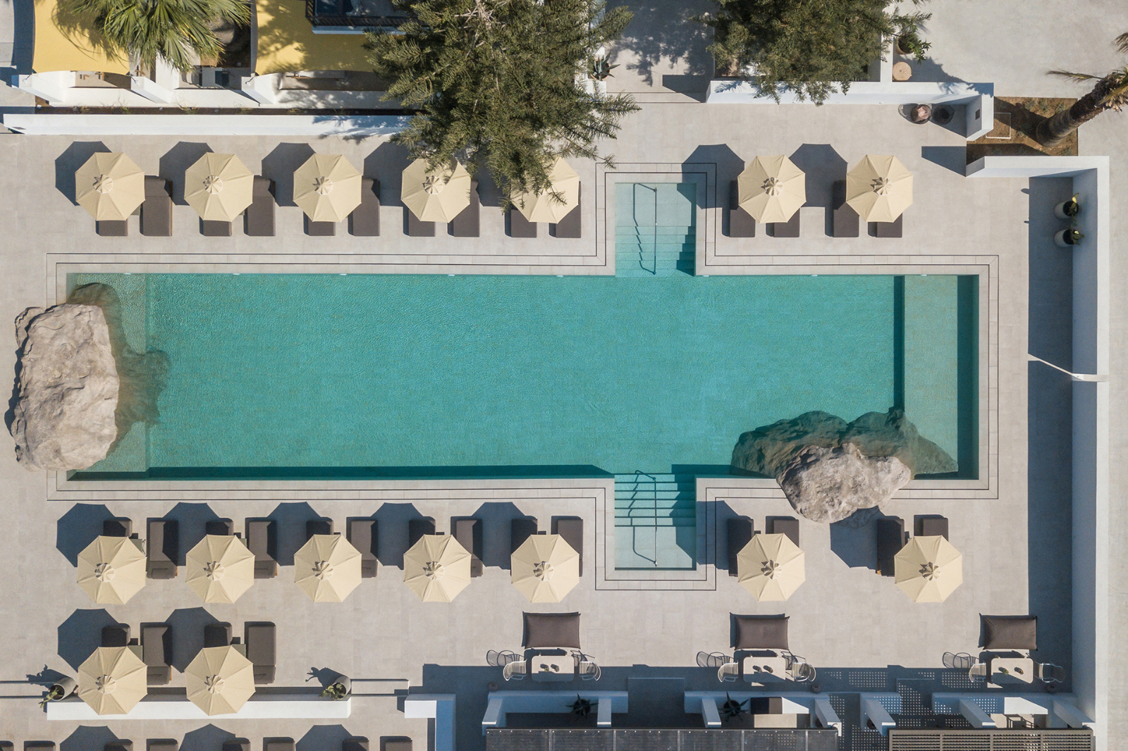 The swimming pool and terrace at Parilio Hotel Paros