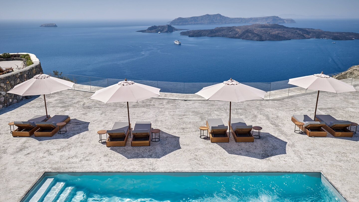 Loungers with sea view at Vedema Santorini Greece