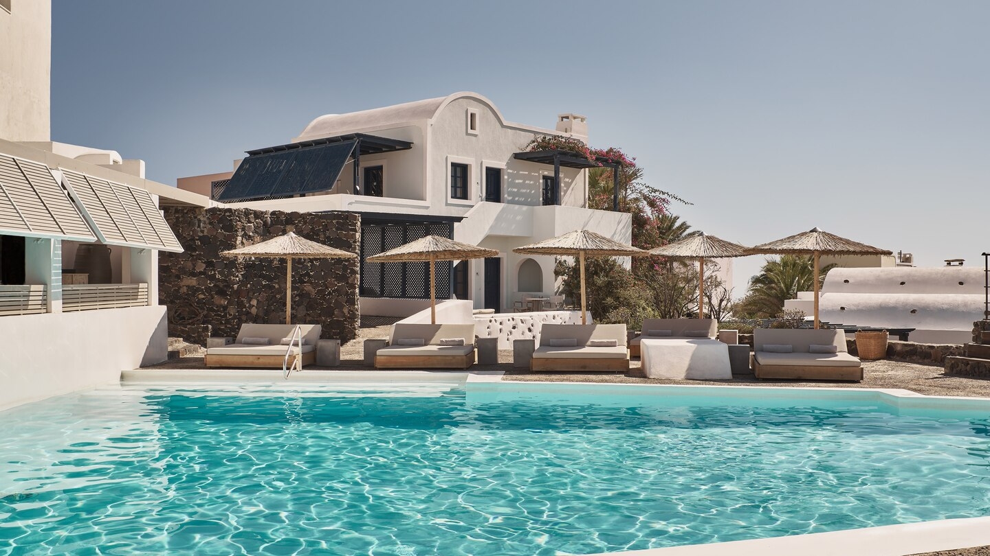Daytime pool scene at Vedema Santorini Greece