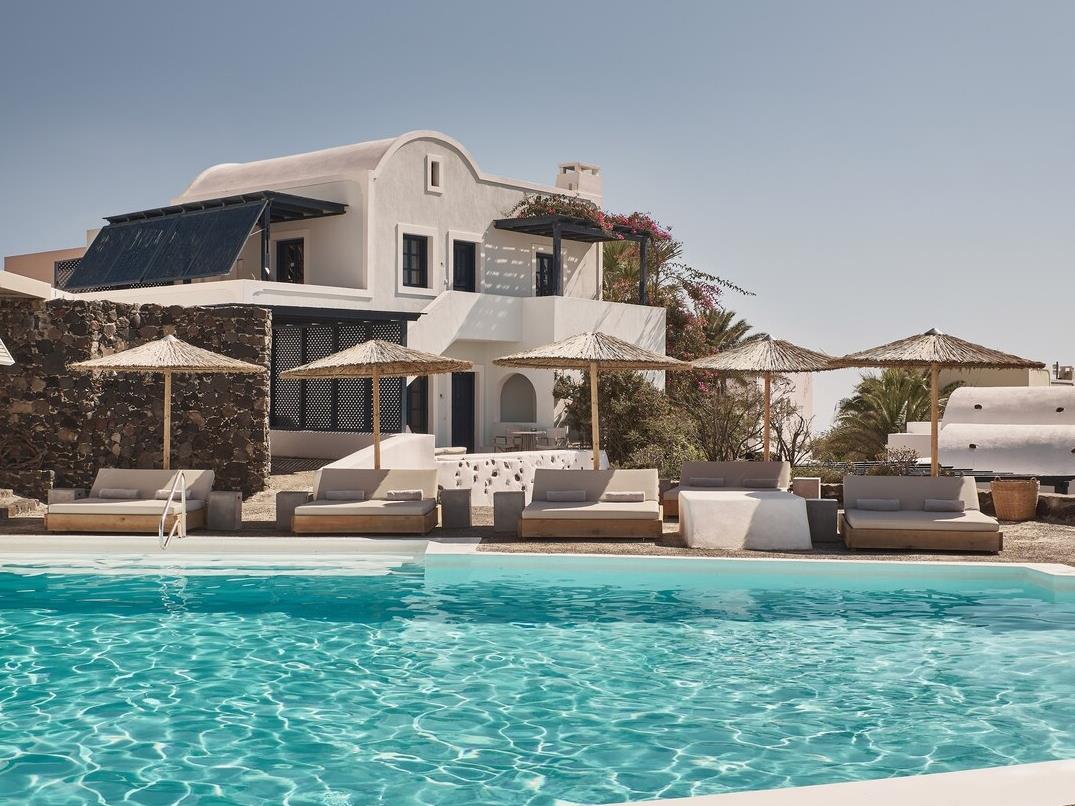 Daytime pool scene at Vedema Santorini Greece