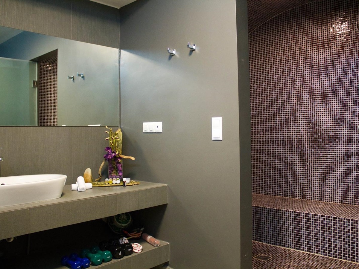 Bathroom with walk-in shower at Almyra Residence