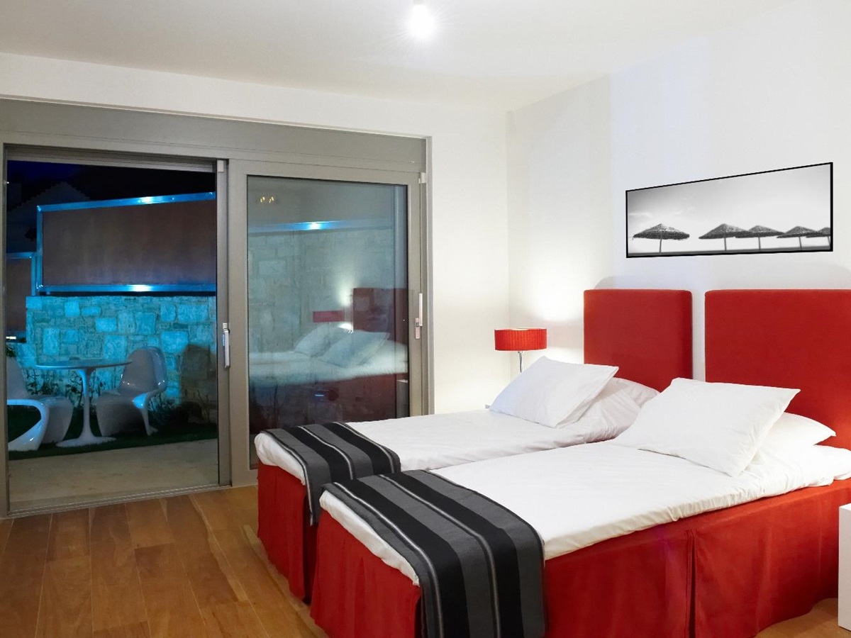 Twin bedroom and outdoor area at Almyra Residence
