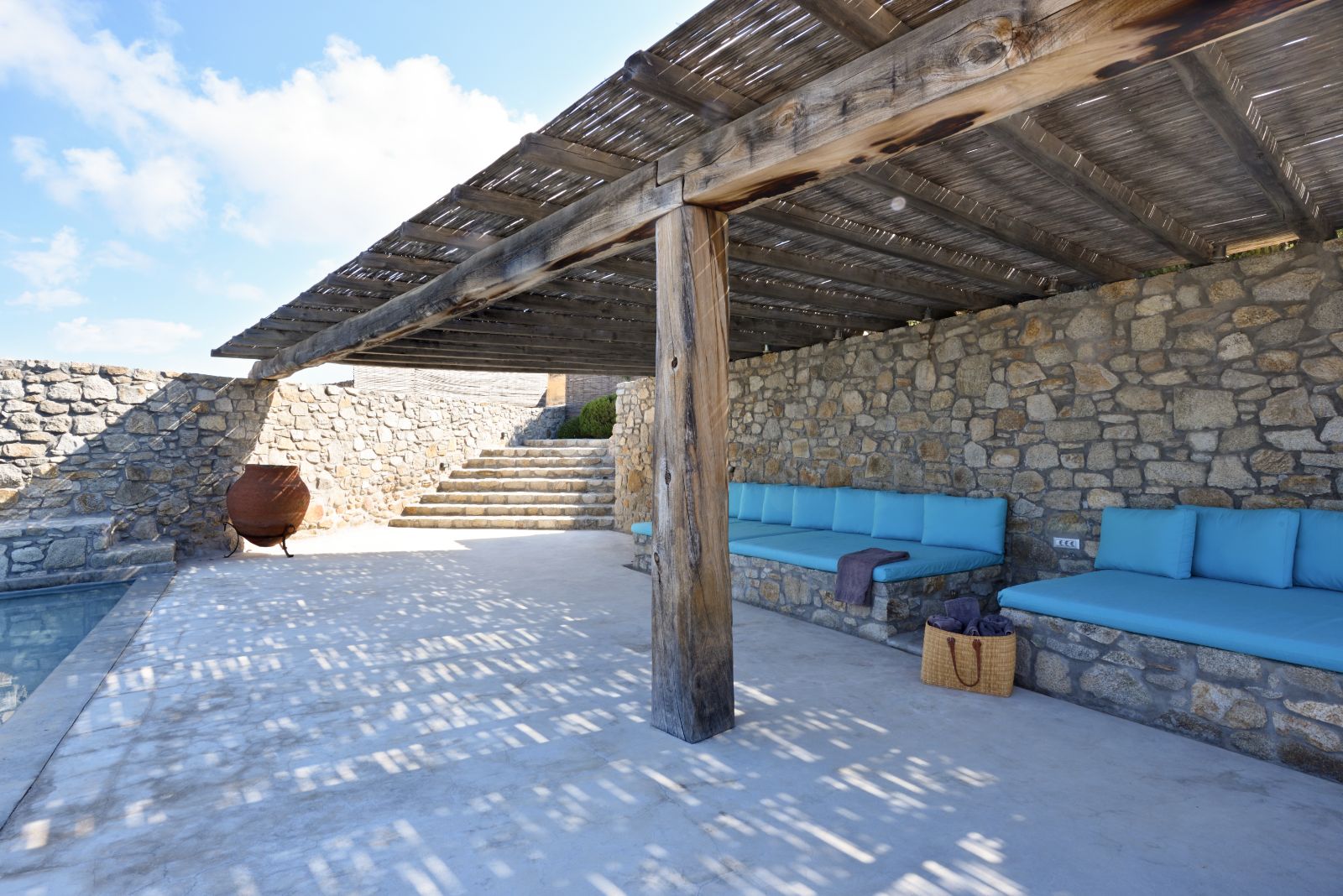 informal outdoor seating area under shady pergola