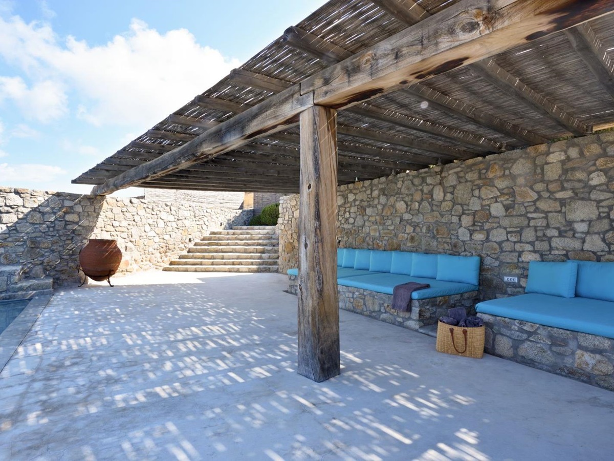 informal outdoor seating area under shady pergola