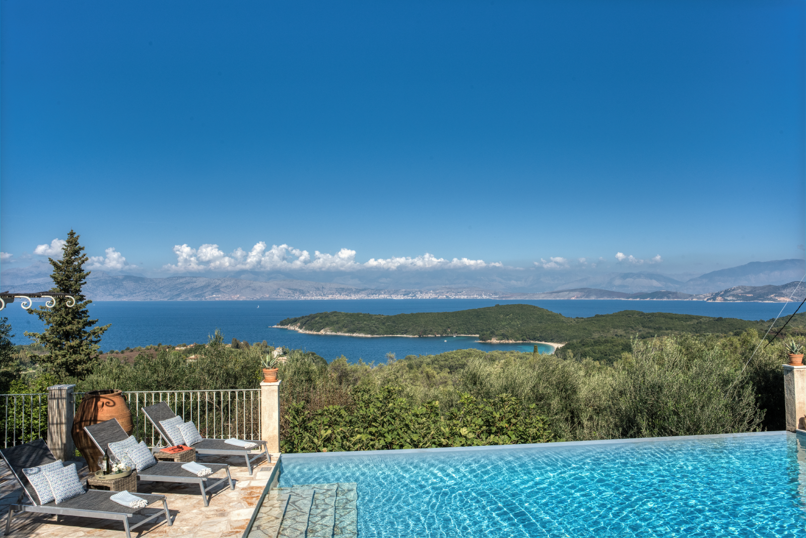 Infinity pool, sun loungers and sea view at Eremitis on Corfu, Greece