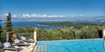 Infinity pool, sun loungers and sea view at Eremitis on Corfu, Greece