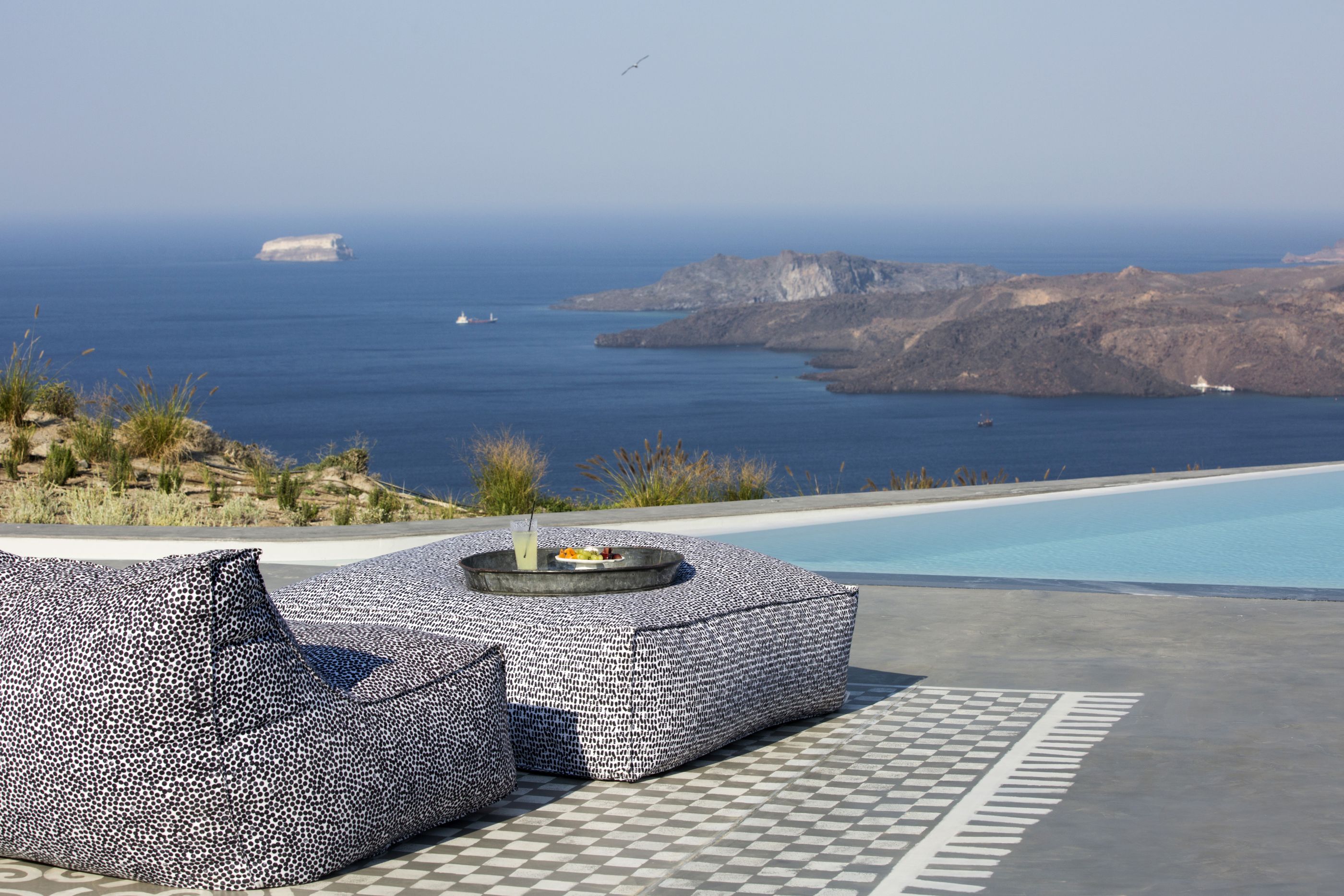 Swimming pool and outdoor seating area at Erosantorini, Greece