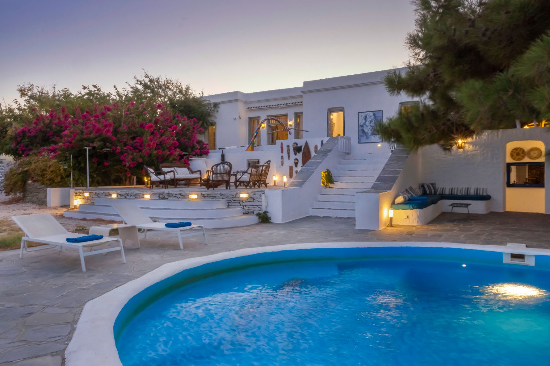 Pool and terrace at night at Exambella, Sifnos
