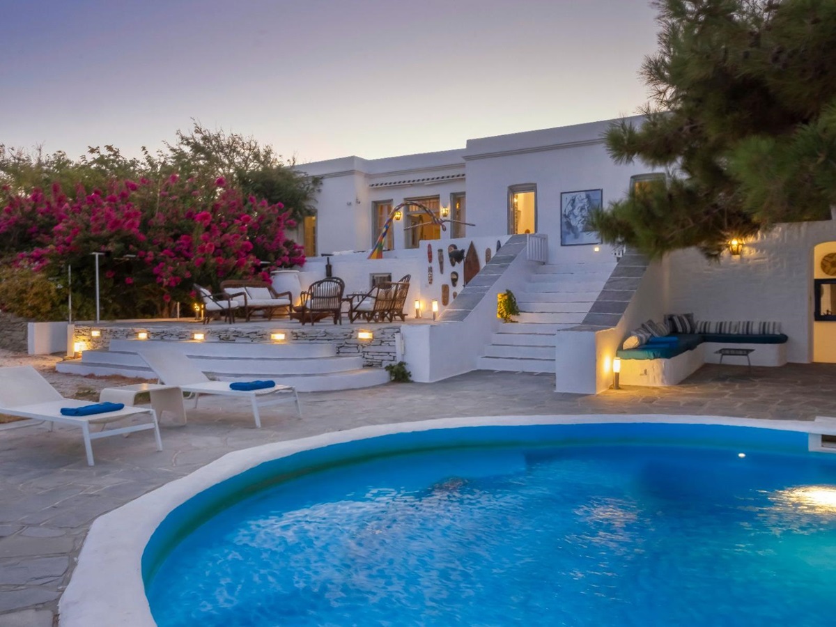 Pool and terrace at night at Exambella, Sifnos