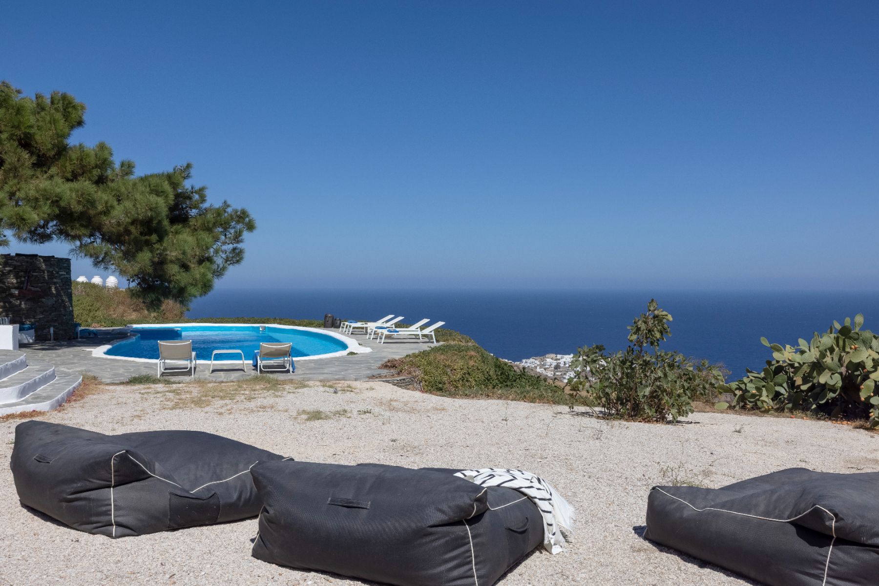 Pool with seating and sea view at Exambella, Sifnos