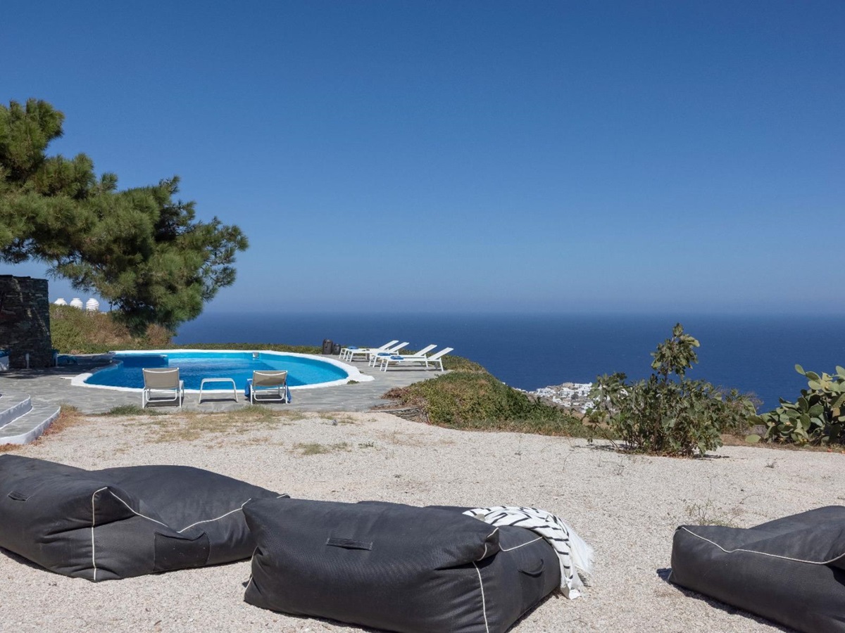 Pool with seating and sea view at Exambella, Sifnos
