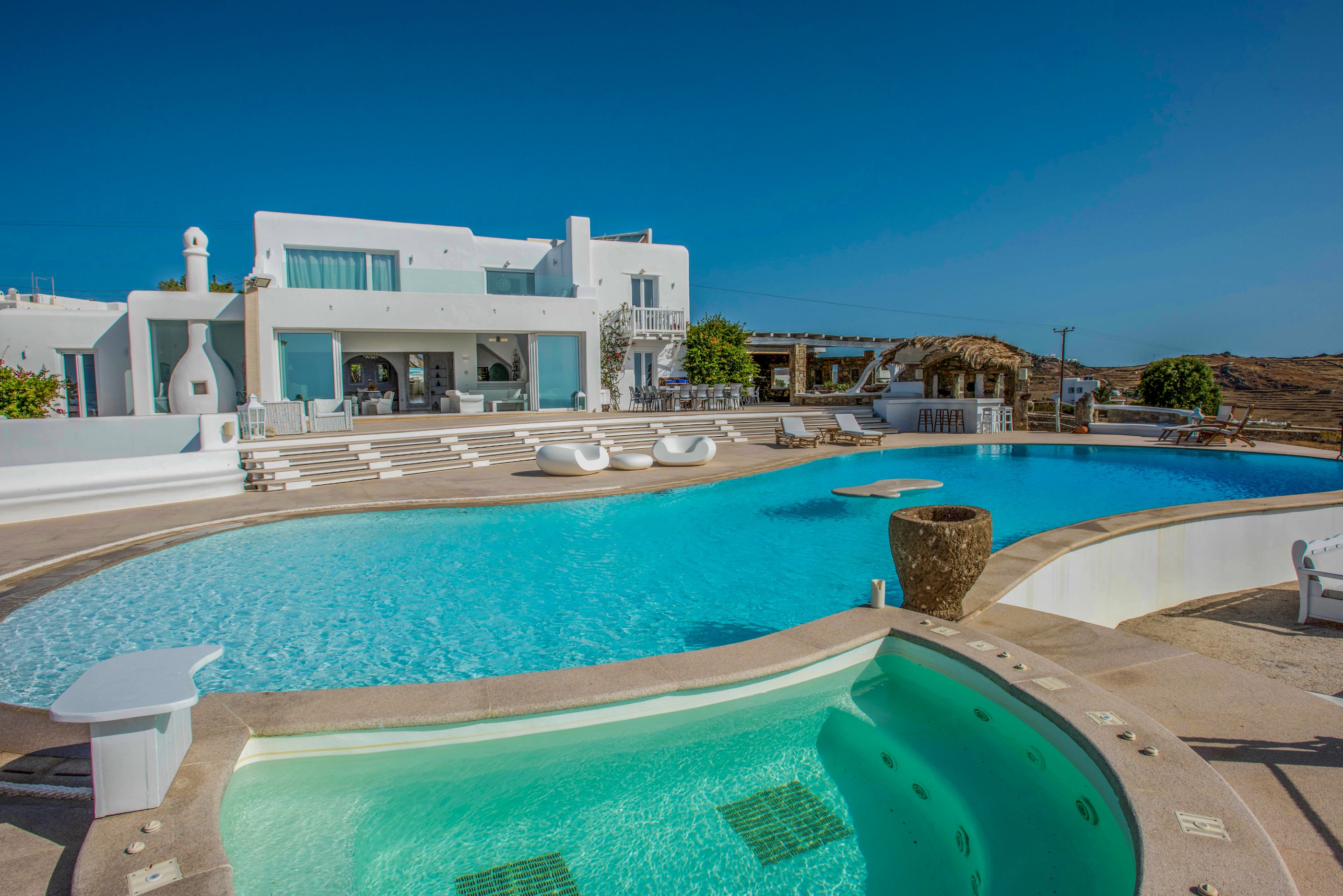 Facade and swimming pool of Kalafati Estate, Greece