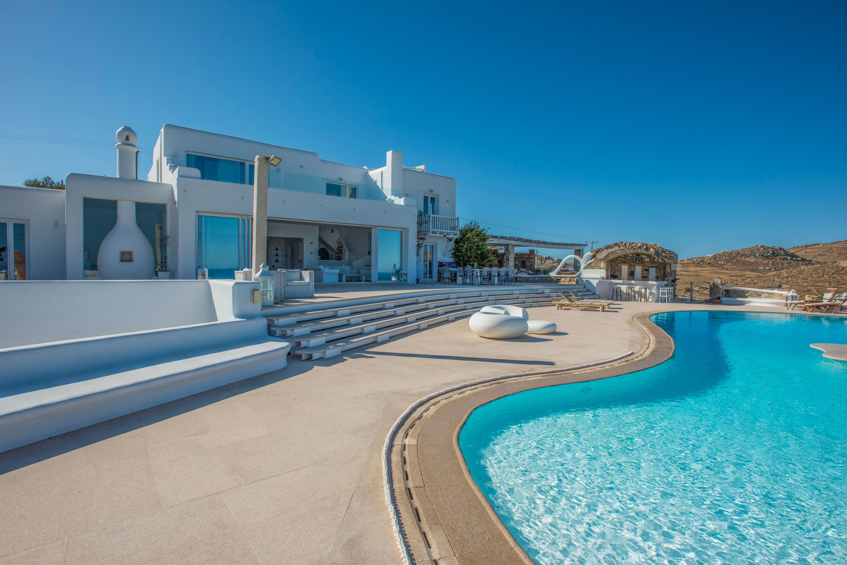 The facade and swimming pool of Kalafati Estate, Greece