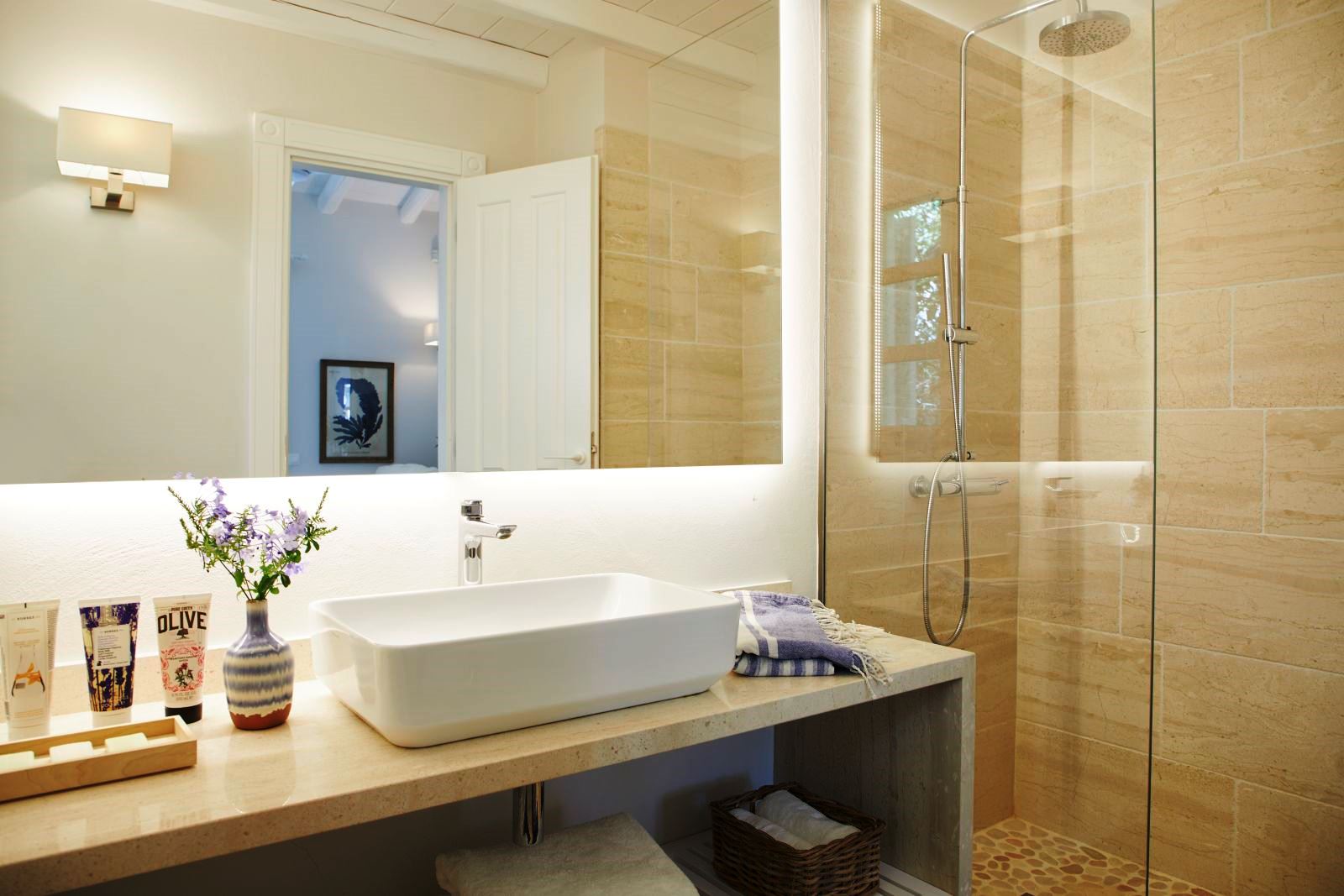 bathroom with sink and walk in shower at kogevina beach villa in corfu, greece