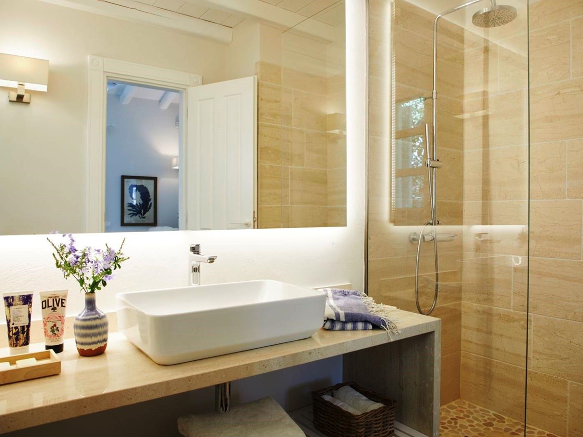 bathroom with sink and walk in shower at kogevina beach villa in corfu, greece