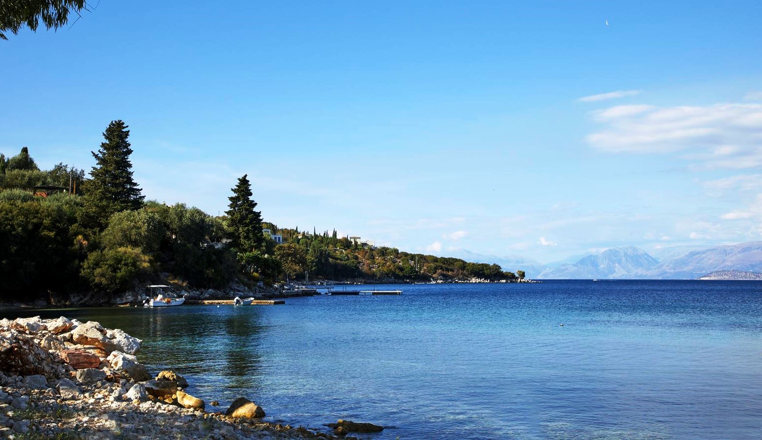 view of the coastline and blue sea from kogevina beach villa in corfu, greece