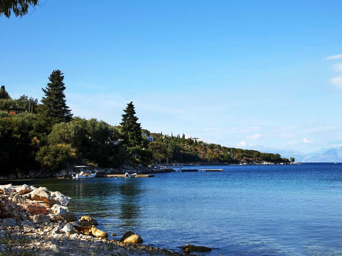 view of the coastline and blue sea from kogevina beach villa in corfu, greece