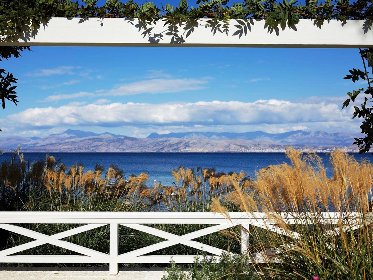 view over the sea with hills in the distance from kogevina beach villa in corfu, greece
