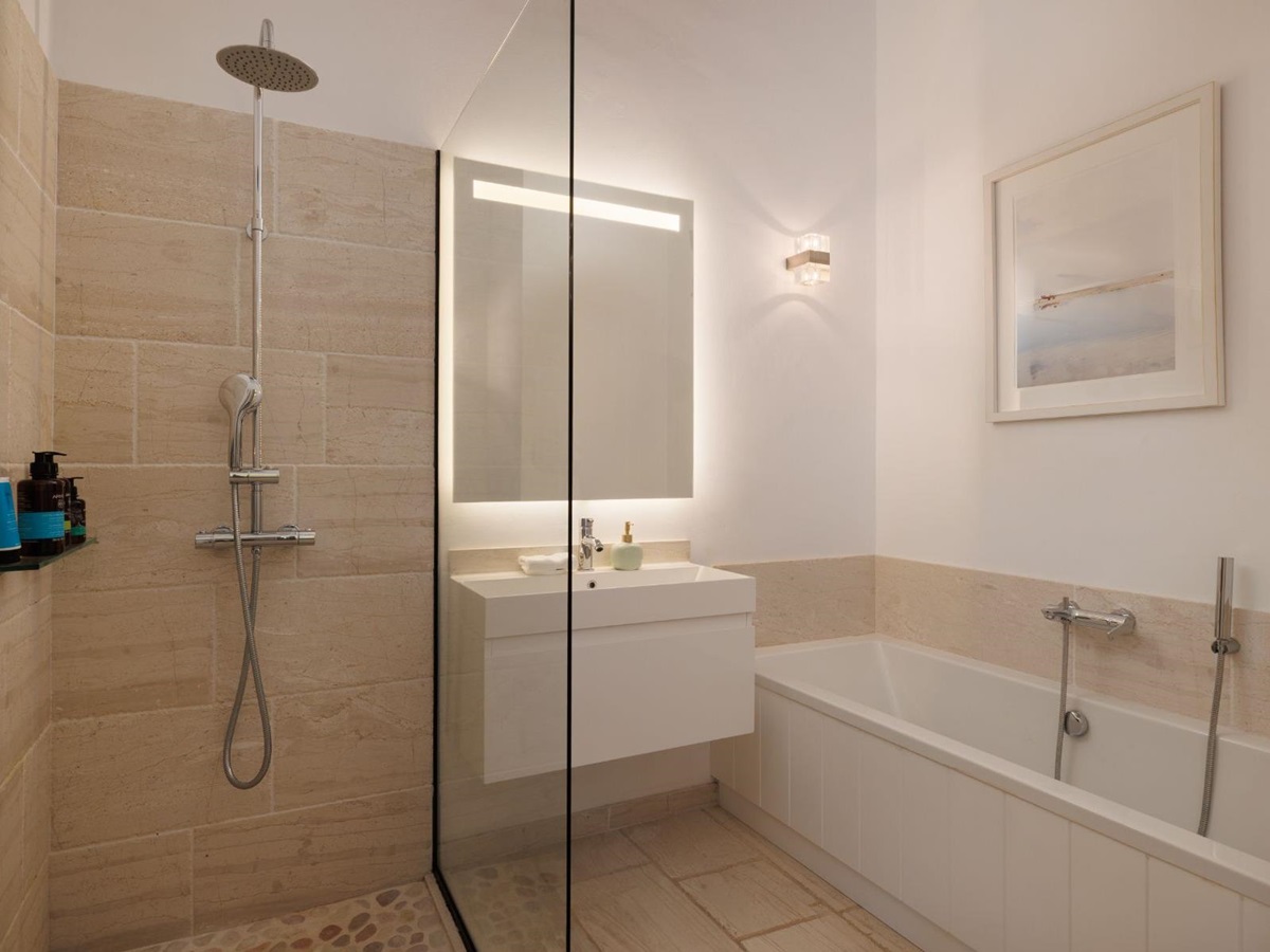Bathroom with shower and bathtub at Thinali, Corfu